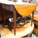 A 19th Century mahogany oval drop leaf occasional table, on square taper supports (cut down)