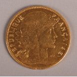 A French 10 franc gold coin dated 1905