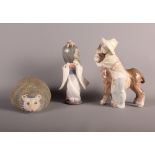 A Lladro figure of a child with donkey, a Lladro figure of Japanese girl and a Lladro model of a