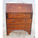 A late 18th Century design mahogany bureau decorated satinwood banding and shell motif to flap,