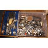 An assortment of silver plated cutlery and ivory handled fish knives and forks, a plated table bell,