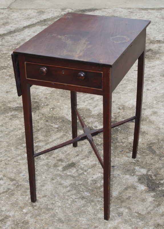 A 19th Century mahogany single flap work table and a 19th Century mahogany and banded chest of two