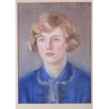 An early 20th Century pastel portrait of a girl in a blue blouse, 16" x 12", in gilt frame, a relief