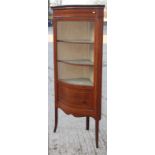 An Edwardian inlaid mahogany floor standing corner display cabinet enclosed serpentine front door,