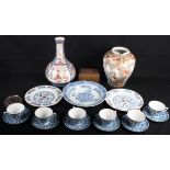 A collection of Japanese porcelain to include plates, a dish, cups and saucers, a Kutani jar, a vase