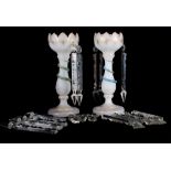 A pair of Victorian white glass table lustres with spear point drops, stems decorated entwined
