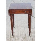 A 19th Century mahogany drop leaf work table, fitted shallow frieze drawer, on turned and reeded