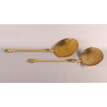 Two 19th Century brass cream skimmers, larger 22" long