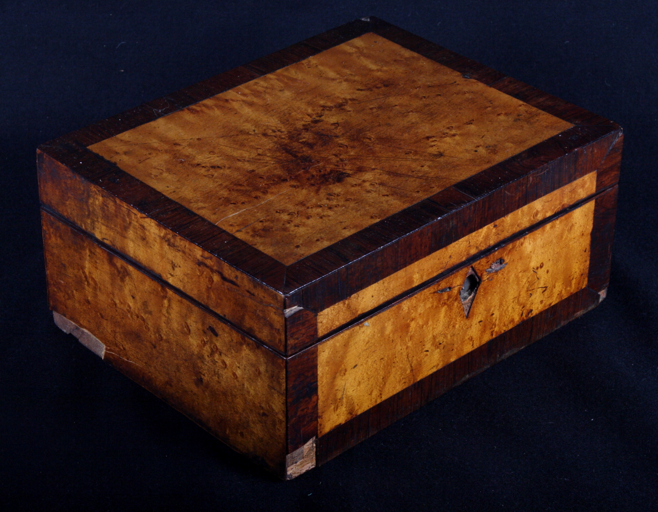 A George III rosewood and maple crossbanded workbox, 10" wide