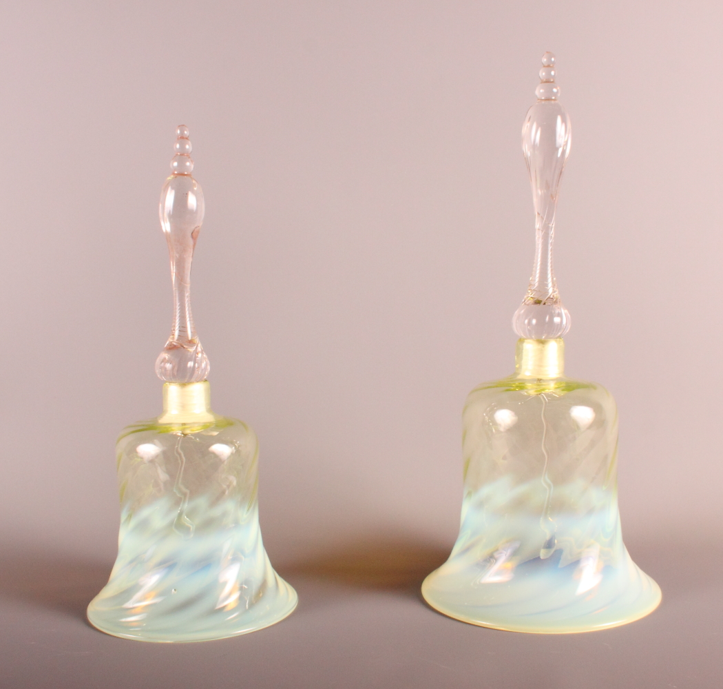 A Victorian Vaseline glass bell with spiral decoration, 13" high, and a smaller similar, 11 1/2"