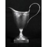 A Georgian silver helmet-shaped pedestal cream jug with beaded decoration, London 1784, 5" high, 3oz