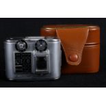 A Tessina automatic sub miniature 35mm camera numbered 64935, in brown leather case