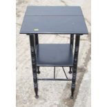 A Liberty design ebonised two-tier side table, on turned supports, 17" square (split top)