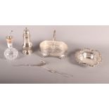 A silver sugar caster, a silver bonbon dish, a glass and silver oil dispenser and a glass and silver