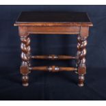 A crossbanded mahogany rectangular stool, on spiral turned supports, 15" x 9"