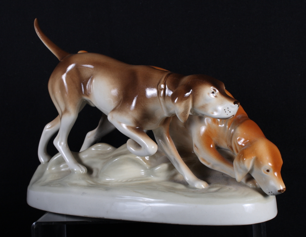 A Royal Dux model of two gun dogs on oval base, 12" wide