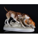 A Royal Dux model of two gun dogs on oval base, 12" wide