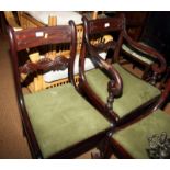 A set of six early 19th Century carved mahogany bar back dining chairs with drop-in seats, on