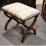 A Georgian design mahogany framed dressing stool, the stuffed over seat upholstered in a striped