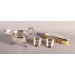 A silver sauce boat of Georgian design, 5.1oz troy approx, a pair of pierced silver napkin rings,