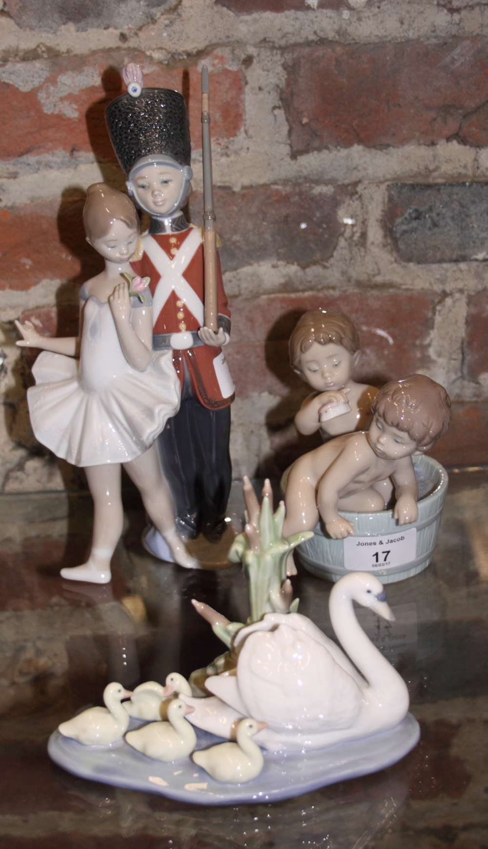 A Lladro group, swan and cygnets "Follow Me", a companion figure, "Bath Time" two children in a tub,