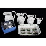 A set of five Portmeirion white relief moulded jugs, a Portmeirion rectangular flan dish and a