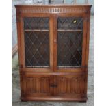 An oak bookcase enclosed leaded glazed doors, 40" wide