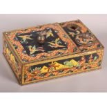A chinoiserie decorated novelty biscuit tin in the form of an inkwell