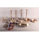 Two pairs of silver plated candlesticks, two plated toast racks, a plated entree dish and cover