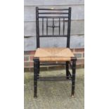 A William Morris design rush seat side chair (broken stretcher) and a Victorian loop back chair