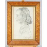 An early 20th Century pencil portrait of a child, indistinctly signed, in maple frame, a crayon