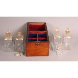 A 19th Century mahogany decanter box containing four square glass decanters with gilt decorated