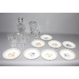 A crystal decanter, six glass tumblers, two glass vases and eight German porcelain plates by Shumann