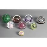 A Strathearn glass paperweight and seven other paperweights by Selkirk, Isle of Wight glass, etc