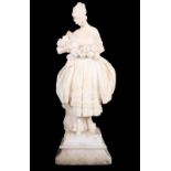 A 1920s carved white marble statue of a young lady in period costume holding a floral swag, 20"
