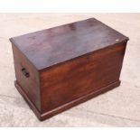 A dark stained pine blanket box fitted side carrying handles, 32" wide