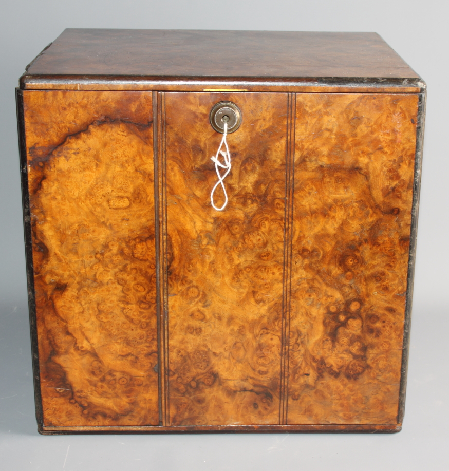 A burr walnut and ebony strung box with part fitted interior, 12" wide