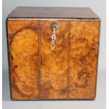 A burr walnut and ebony strung box with part fitted interior, 12" wide