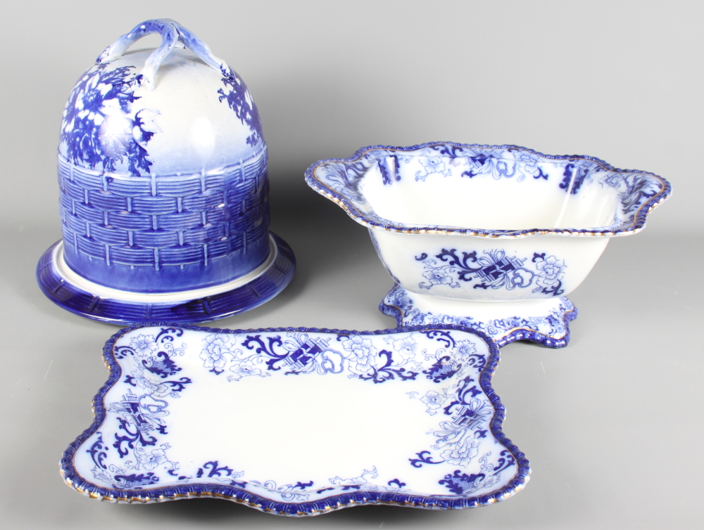 A blue and white cheese dish with domed cover and a blue and white tureen and stand