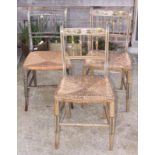 A pair of 19th Century rush seat occasional chairs with grey floral painted frames