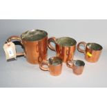 A set of five War Department cylindrical copper measuring jugs, circa 1900