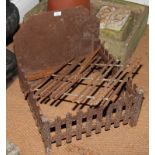 A rectangular slatted iron fire basket, 20" wide