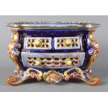 A 19th Century Zsolnay Pecs Pottery miniature chest decorated blue, pink, brown and green, 7 1/2"