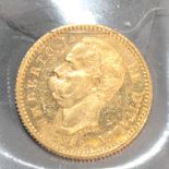 An Italian gold 20-lira gold coin, dated 1882