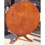 A Georgian design mahogany circular tilt top dining table, on tripod base, 44" dia