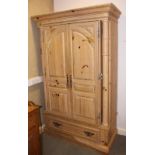 A continental pine cabinet enclosed two doors, fitted lower drawer, 49" wide