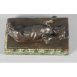 An unsigned bronze sculpture of a dog lying on its back, on green marble base, 5 1/2" x 3", and a