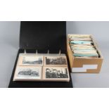 A collection of assorted early 20th Century postcards, loose and in album