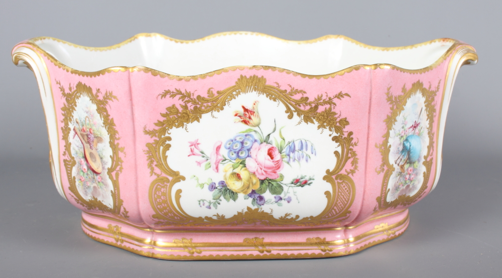 A Sevres porcelain jardiniere decorated reserves of flowers, putti and musical instruments on a pink - Image 5 of 8