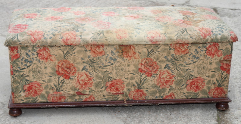 A 19th Century ottoman, upholstered in a floral print fabric, 48" long (for reupholstery)